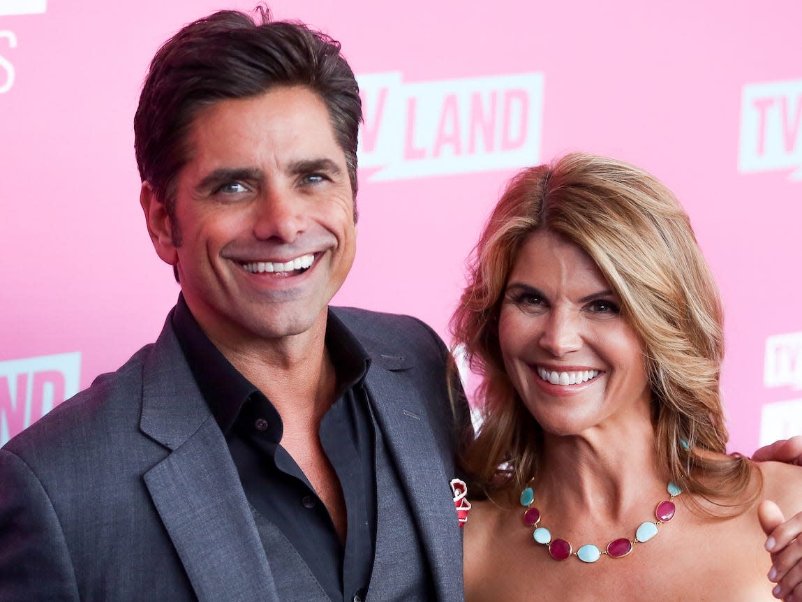 John Stamos, left, and Lori Loughlin arrive at the 2016 TV Land Icon Awards at Barker Hangar on Sunday, April 10, 2016.