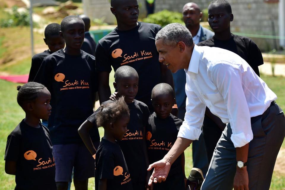 The former US President interacts with some of the local young beneficiaries July 16, 2018 during the opening of the Sauti Kuu Resource Centre, founded by his half-sister, Auma Obama: AFP/Getty Images