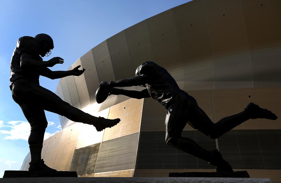 Steve Gleason's punt block against the Falcons was immortalized in a statue titled "Rebirth." (Photo by Jonathan Bachman/Getty Images)