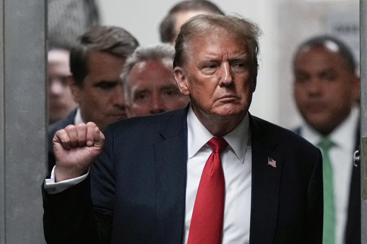 Former President Donald Trump gestures while returning from a break at Manhattan Criminal Court, Tuesday, May 28, 2024, in New York. (Julia Nikhinson/ Pool via AP)