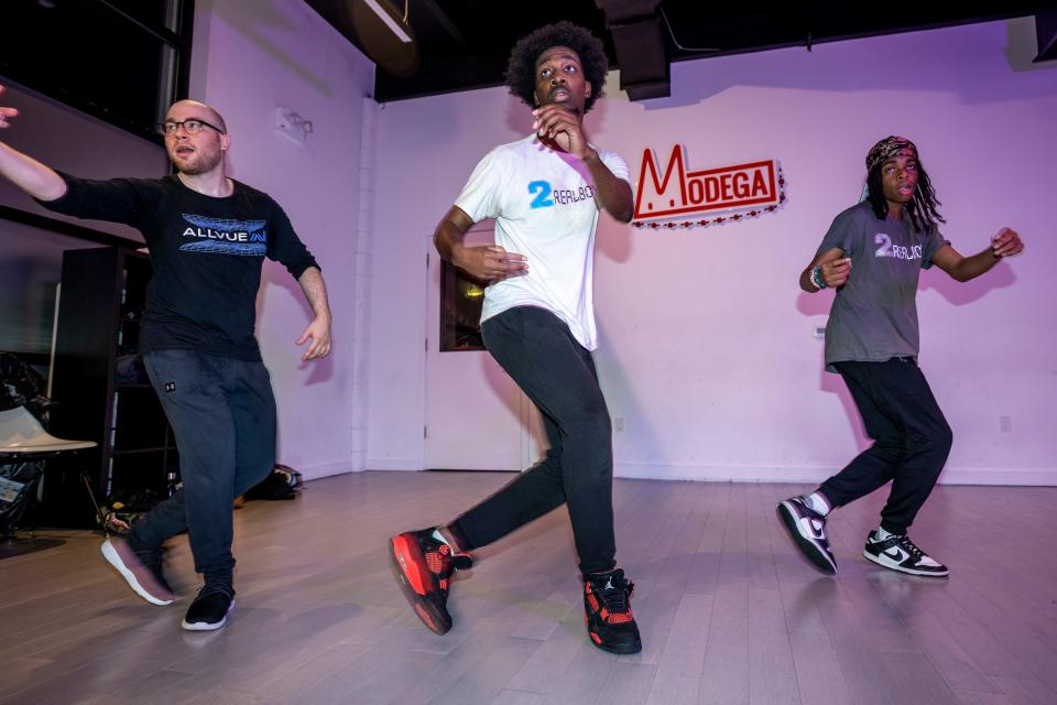 Jay Black teaches a Litefeet dance class at Modega in the Long Island City sections of Queens on Thursday, Dec. 15, 2022. (From left) Mark Cohen, Jay Black and Jaeran Mauricio, who goes by Loco.