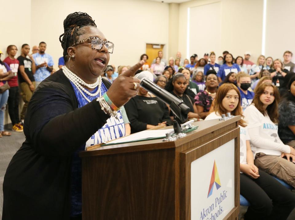 Victoria McGee, director of the I Promise Family Resource Center, addresses the Akron School Board at packed with supporters of the I Promise School in Akron.