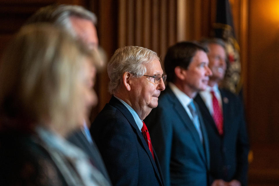 US Senator Majority Leader Mitch McConnell (R-KY), poses with newly elected Republican Senators, left to right, Senator-elect Cynthia Lummis, R-Wyo., Senator-elect Tommy Tuberville, R-Ala., Senator-elect Bill Hagerty, R-Tenn., and Senator-elect Roger Marshall, R-Kan. On Capitol Hill in Washington, DC on November 9, 2020. (Photo by KEN CEDENO / POOL / AFP) (Photo by KEN CEDENO/POOL/AFP via Getty Images)