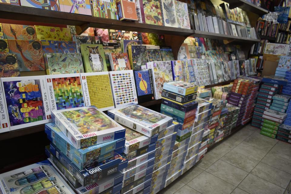 Hundreds of puzzles for holiday gift giving fill the Book Corner in downtown Bloomington.