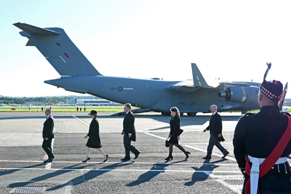 Dignitaries prepare for the arrival of the coffin of Queen Elizabeth II at Edinburgh Airport (PA) (PA Wire)