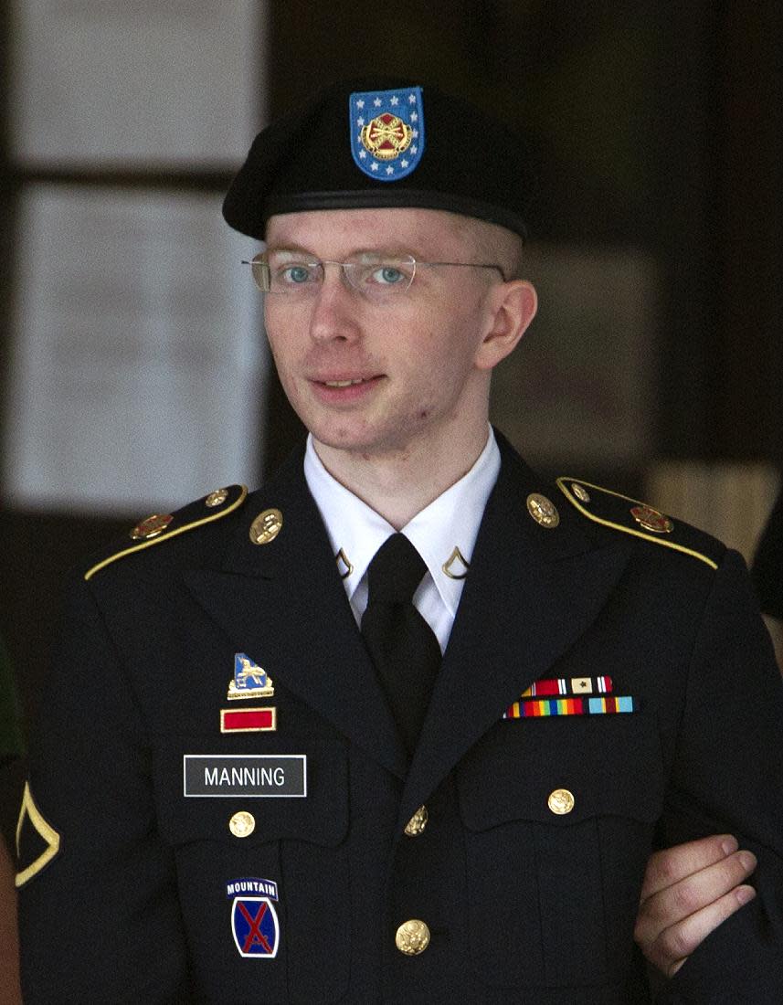 FILE - In this Tuesday, July 2, 2013, file photo, Army Pfc. Bradley Manning is escorted out of a courthouse in Fort Meade, Md., during the fifth week of his court-martial. Manning, who was tried and convicted for leaking U.S. secrets to WikiLeaks, is petitioning a Kansas court for a name change, to Chelsea Elizabeth Manning. (AP Photo/Jose Luis Magana, File)