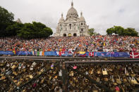 Ali Labib, of Iran, rides past the Sacre Coeur basilica, during the men's road cycling event, at the 2024 Summer Olympics, Saturday, Aug. 3, 2024, in Paris, France. (AP Photo/Vadim Ghirda)