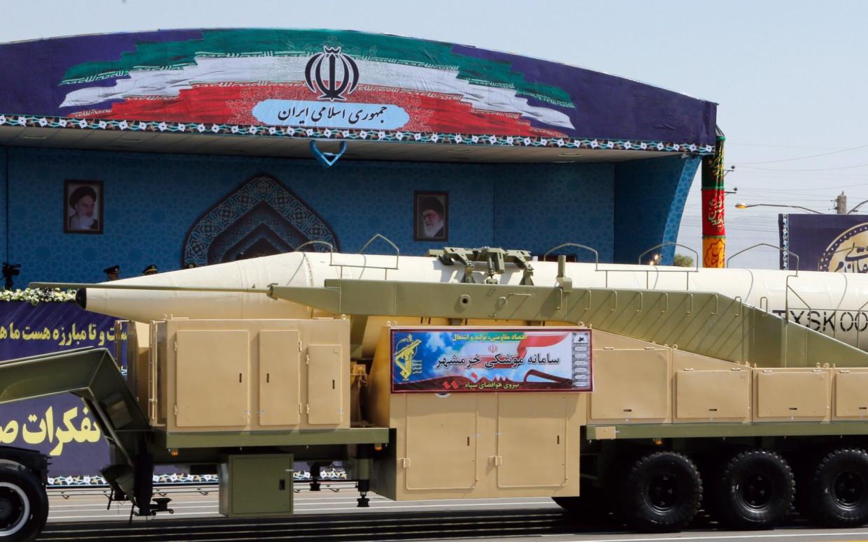 Iranian long range missile Khoramshahr is displayed during the annual military parade marking the Iraqi invasion in 1980 - EPA
