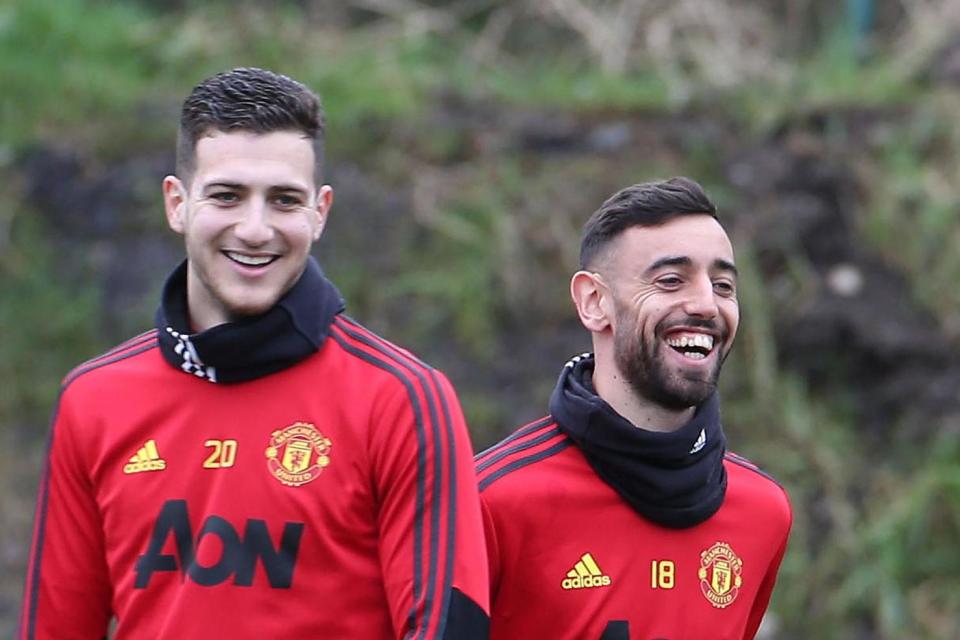 Friends: Dalot and Fernandes Photo: Manchester United via Getty Images