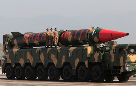 Pakistani military personnel stand beside a Shaheen III surface-to-surface ballistic missile during Pakistan Day military parade in Islamabad, Pakistan, March 23, 2017. REUTERS/Faisal Mahmood