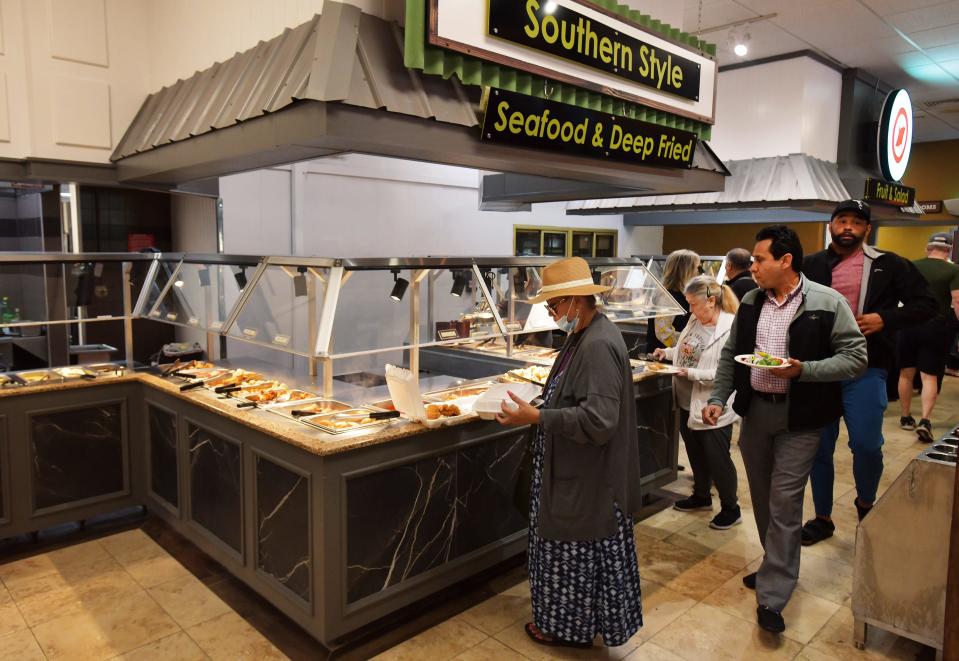 Customers make their selections from the Southern Style Seafood & Deep Fried bar at newly opened Chow's Country Buffet, which features Southern-style and Asian-style offerings.