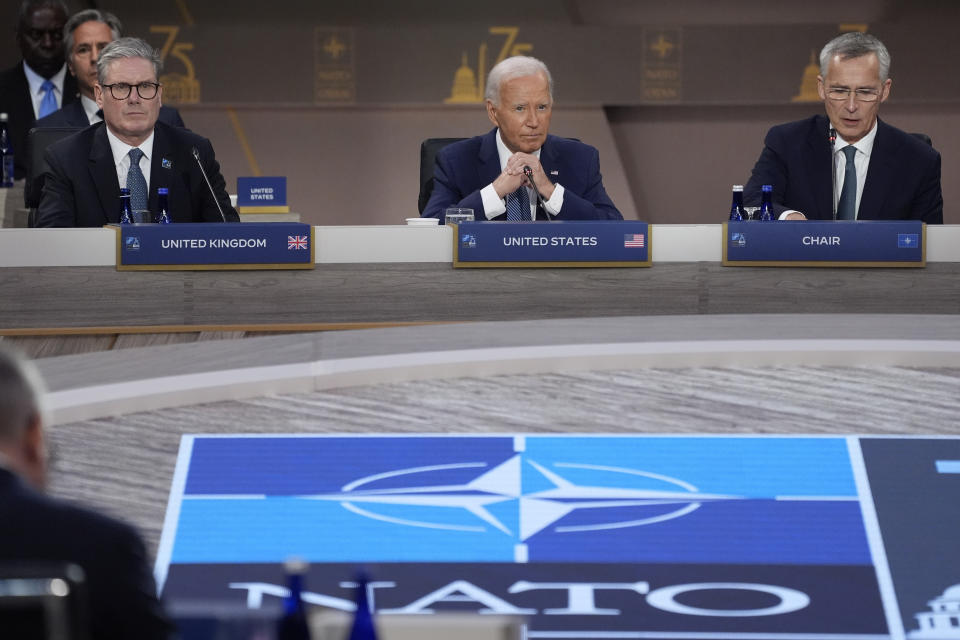 President Joe Biden speaks during the opening session of the NATO Summit, Wednesday, July 10, 2024, in Washington. At left is British Prime Minister Keir Starmer and at right is NATO Secretary General Jens Stoltenberg. (AP Photo/Evan Vucci)