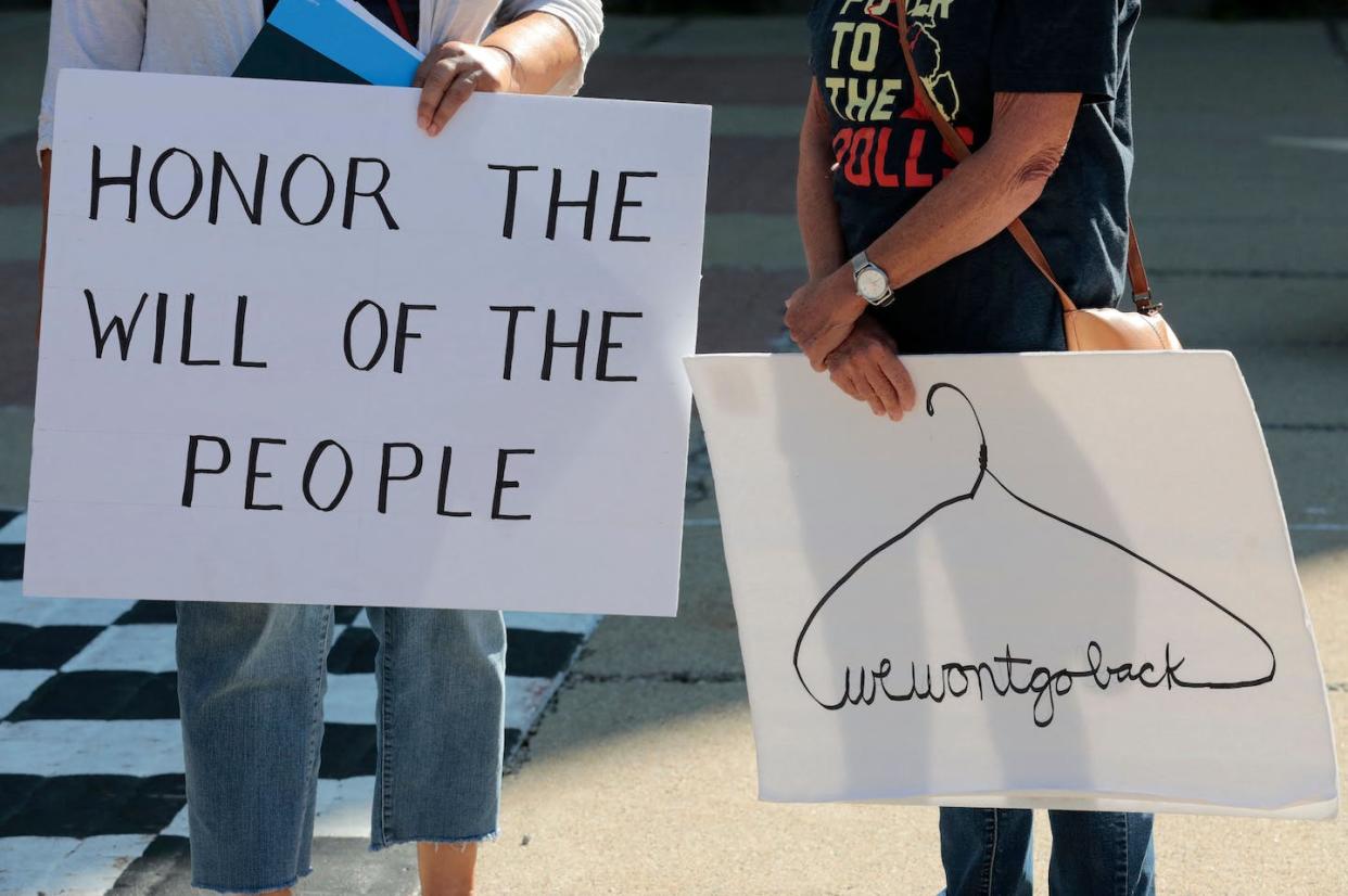 The Supreme Court's overturning of Roe v. Wade has led to a push for citizens initiatives to enshrine abortion rights. <a href="https://www.gettyimages.com/detail/news-photo/abortion-rights-activists-gather-during-a-restore-roe-rally-news-photo/1243016789?adppopup=true" rel="nofollow noopener" target="_blank" data-ylk="slk:Jeff Kowalsky/AFP via Getty Images;elm:context_link;itc:0;sec:content-canvas" class="link ">Jeff Kowalsky/AFP via Getty Images</a>