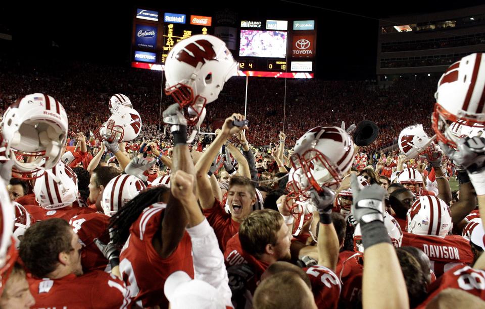 Students and Badger fans rush the field after the University of Wisconsin upset the No. 1-ranked Ohio State Buckeyes at Camp Randall Stadium, 31-18, on Oct. 16, 2010.