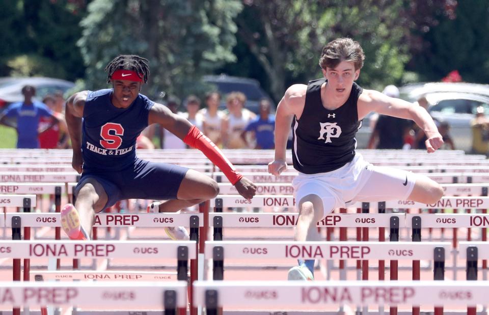 Quinn Kennedy of Fordham Prep, right, finished first in the 110 meter hurdles at the Eastern States track and field meet at Iona Prep in New Rochelle June 5, 2022. Eloho Karmiel-Yitzchak of Stepinic, left, finished second.
