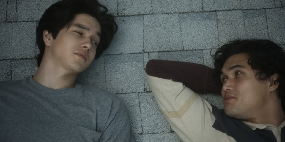 Joe and his son lying on the roof from "May December"