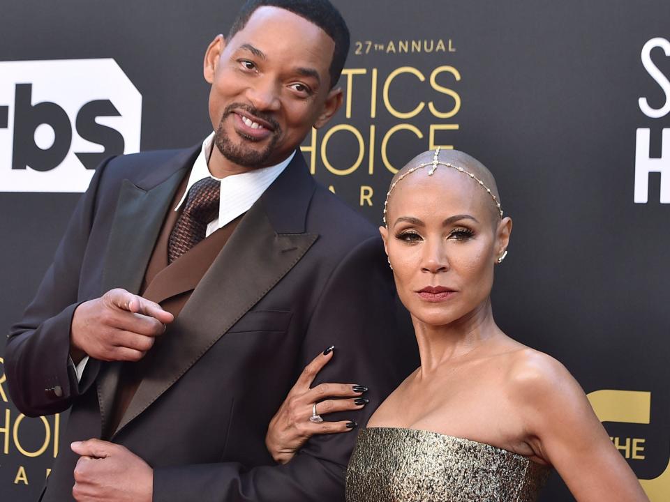 Will Smith and Jada Pinkett Smith posing at the red carpet of the 2022 Critics Choice Awards.