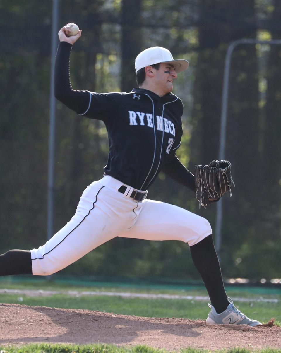 Rye Neck's George Katsaros delivers a pitch during a game with Pleasantville at Rye Neck April 27, 2024. The game was suspended because of lightning.