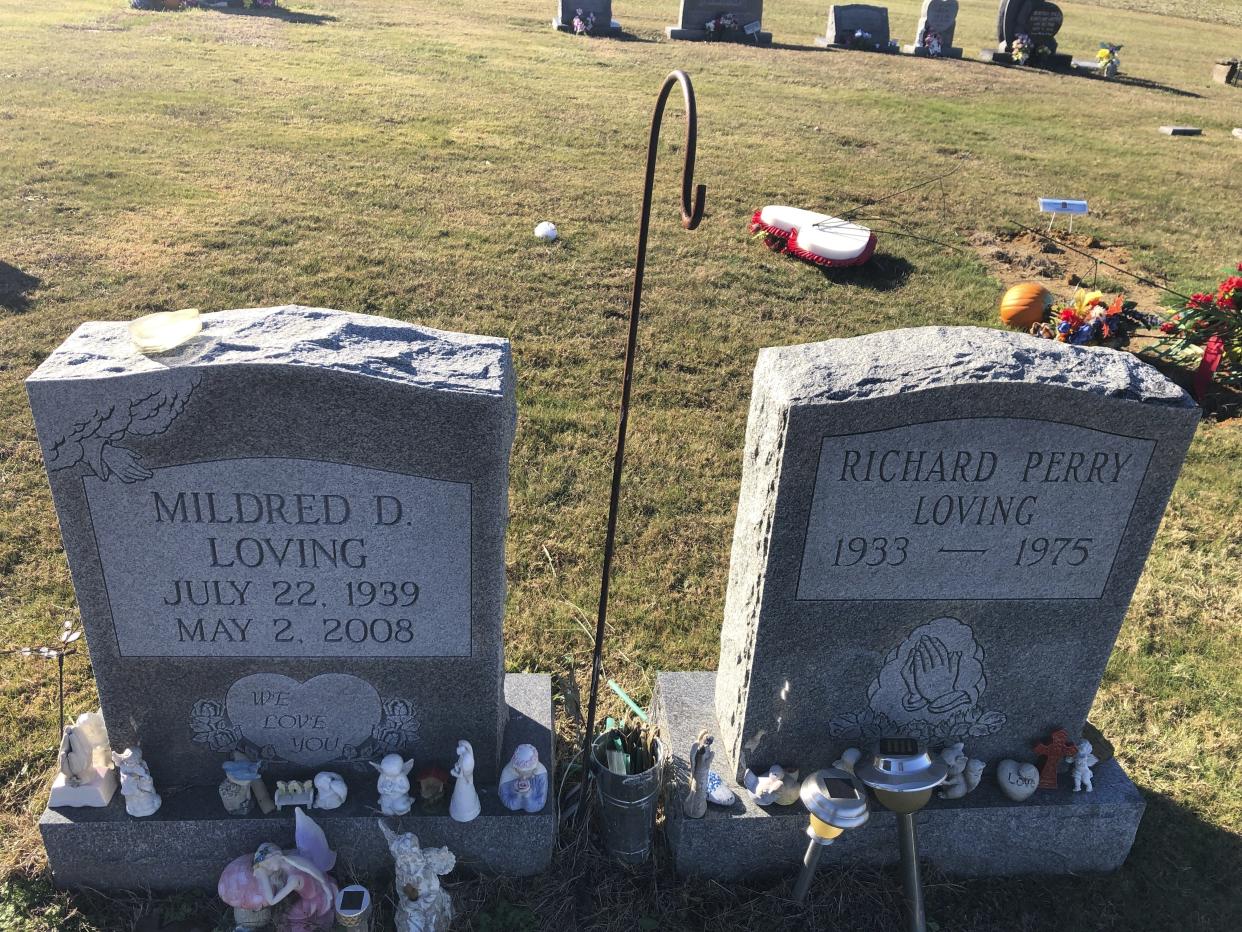 The graves of Virginia couple Richard and Mildred Loving stand at St. Stephen’s Baptist Church Cemetery on Thursday, Dec. 1, 2022, in Central Point, Va. The interracial couple's legal challenge led to a 1967 U.S. Supreme Court ruling that struck down state laws banning marriages between people of different races. The Respect for Marriage Act enshrines interracial and same-sex marriages in federal law. (AP Photo/Denise Lavoie)