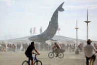 <p>Participants gather around The Space Whale art installation as approximately 70,000 people from all over the world gather for the 30th annual Burning Man arts and music festival in the Black Rock Desert of Nevada, Aug. 29, 2016. (REUTERS/Jim Urquhart)</p>