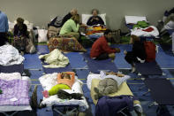 <p>People prepare to spend the night in a makeshift camp set up inside a gymnasium following an earthquake, in Amatrice, central Italy, Thursday, Aug. 25, 2016. (AP Photo/Andrew Medichini) </p>