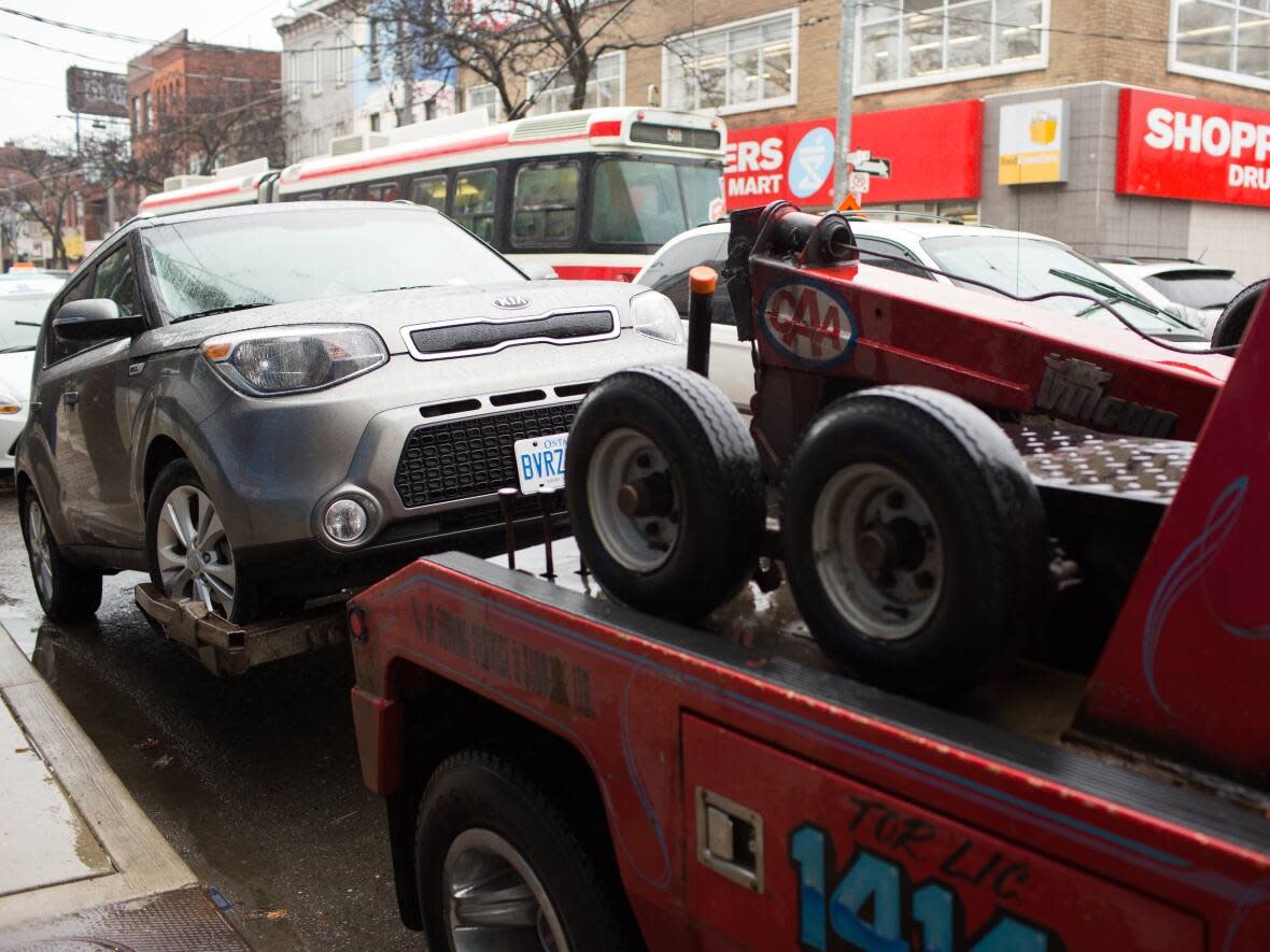 Toronto police say they will also resume towing of vehicles blocking rush hour routes starting July 4. Vehicles caught blocking intersections could face a fine of $125.  (Katherine Holland/CBC - image credit)