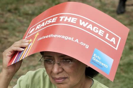 Georgina Serrano attends a celebration event for the signing of an ordinance raising the city's minimum wage to $15 an hour by 2020 from the current $9 in Los Angeles, California June 13, 2015. REUTERS/Jonathan Alcorn