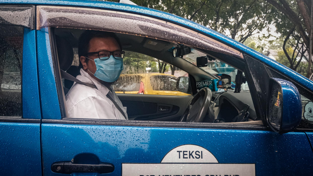 KUALA LUMPUR, MALAYSIA - SEPTEMBER 10: Mohd Faiz Hashim a taxi driver poses for a photo during an interview in Kuala Lumpur, Malaysia on September 10, 2020. Business owners and workers are still feeling stagnant despite Malaysian governmet imposed Recovery Moment Control Order (RMCO) after the coronavirus eased. (Photo by Syaiful Redzuan/Anadolu Agency via Getty Images)