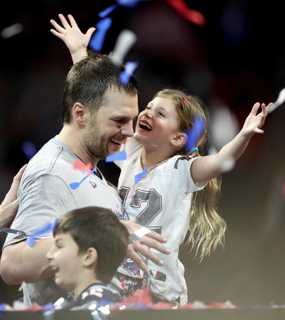 Tom Brady, his daughter Vivian Lake Brady and his son Benjamin celebrate the Patriots' win during Super Bowl LIII at Mercedes-Benz Stadium on February 3, 2019 in Atlanta, Georgia