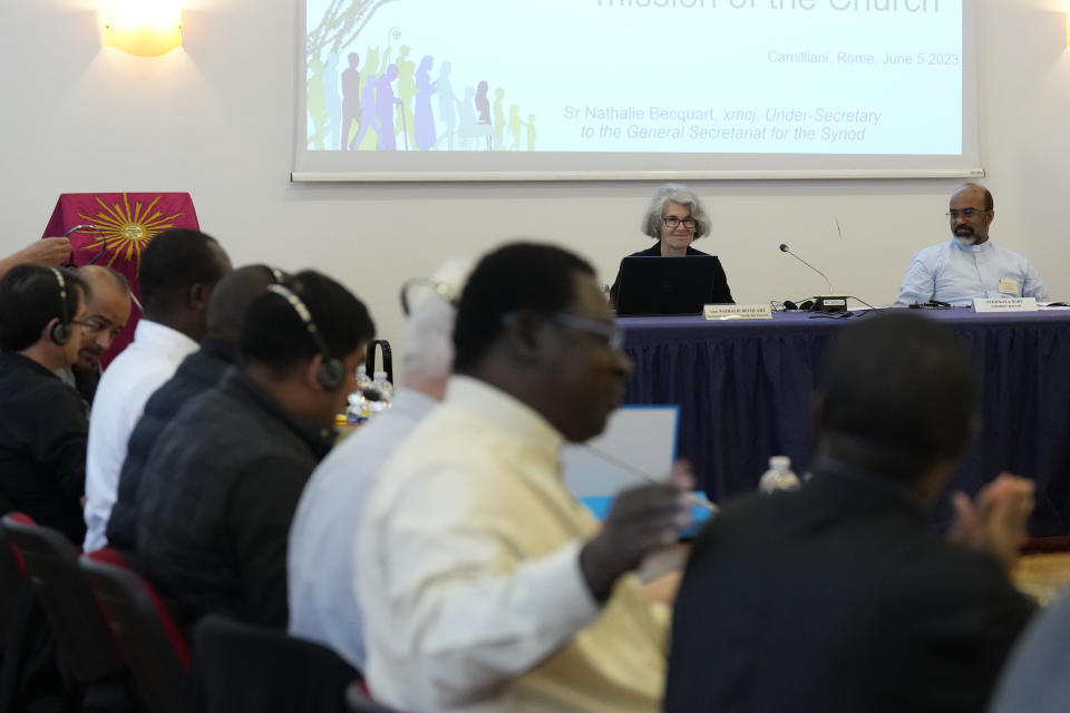 Sister Nathalie Becquart, right, the first female undersecretary in the Vatican's Synod of Bishops, gives a lesson to a religion male congregation in Sacrofano, near Rome, Monday, June 5, 2023. Becquart is charting the global church through an unprecedented, and even stormy, period of reform as one of the highest-ranking women at the Vatican. (AP Photo/Alessandra Tarantino)