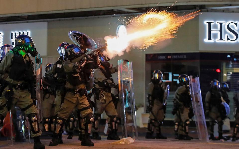  Riot police fire tear gas during the anti-extradition bill protest in Hong Kong on Aug. 11, 2019. - AP Photo/Kin Cheung