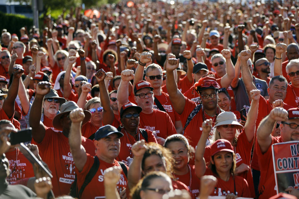 Union workers protest in front of the Palms casino-resort, Wednesday, June 26, 2019, in Las Vegas. Members of a powerful Las Vegas casino workers union and other hospitality workers picketed outside the Palms, which has refused to bargain with the union. (AP Photo/John Locher)