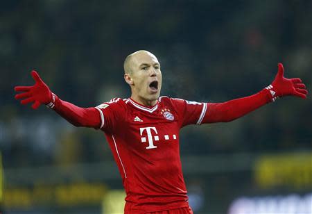 Bayern Munich's Arjen Robben celebrates after he scored a goal against Borussia Dortmund during their German first division Bundesliga soccer match in Dortmund, November 23, 2013. REUTERS/Kai Pfaffenbach