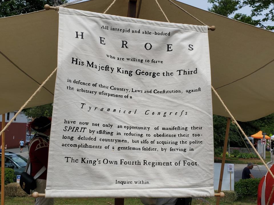 A recruitment banner for the British is seen during the American Independence Festival in Exeter Saturday, June 16, 2022.