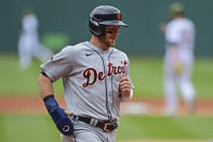 Detroit Tigers' Robbie Grossman scores a run on an RBI-double by Miguel Cabrera in the first inning of a baseball game against the Cleveland Guardians, Sunday, May 22, 2022, in Cleveland. (AP Photo/David Dermer)