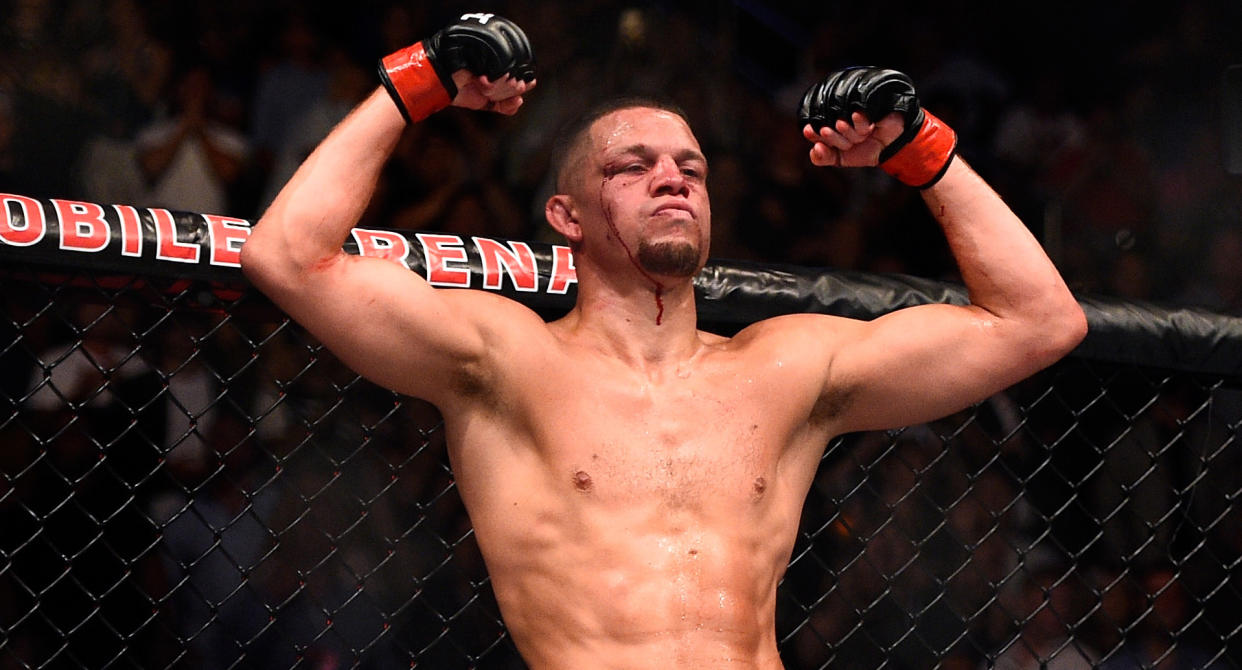 Nate Diaz gestures across the Octagon in his corner toward Conor McGregor of Ireland in their welterweight bout during the UFC 202 event at T-Mobile Arena on August 20, 2016 in Las Vegas, Nevada. (Getty Images)