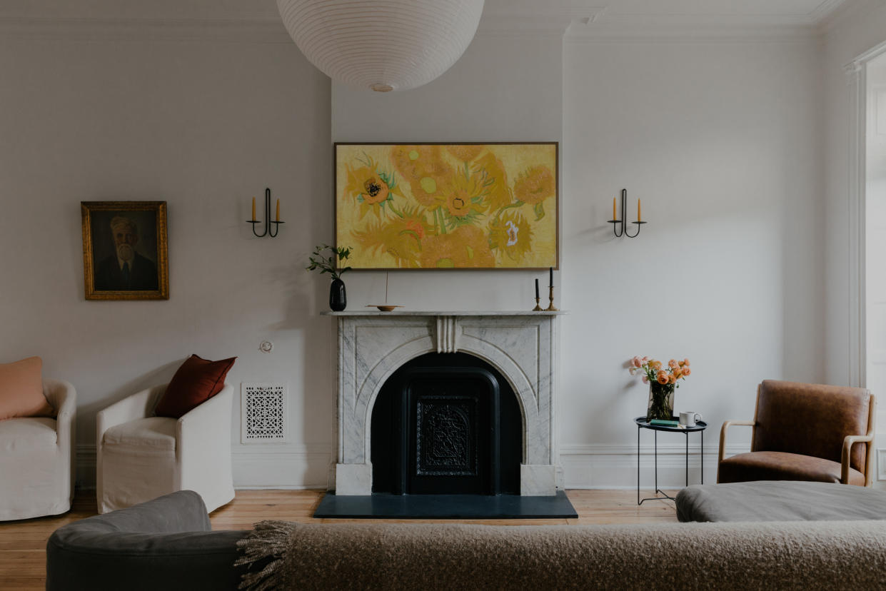  A tv placed above the fireplace. 