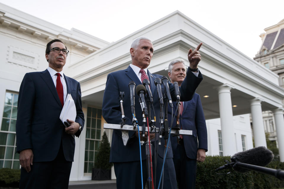 Vice President Mike Pence, center, with Steven Mnuchin, left, and Robert O'Brien