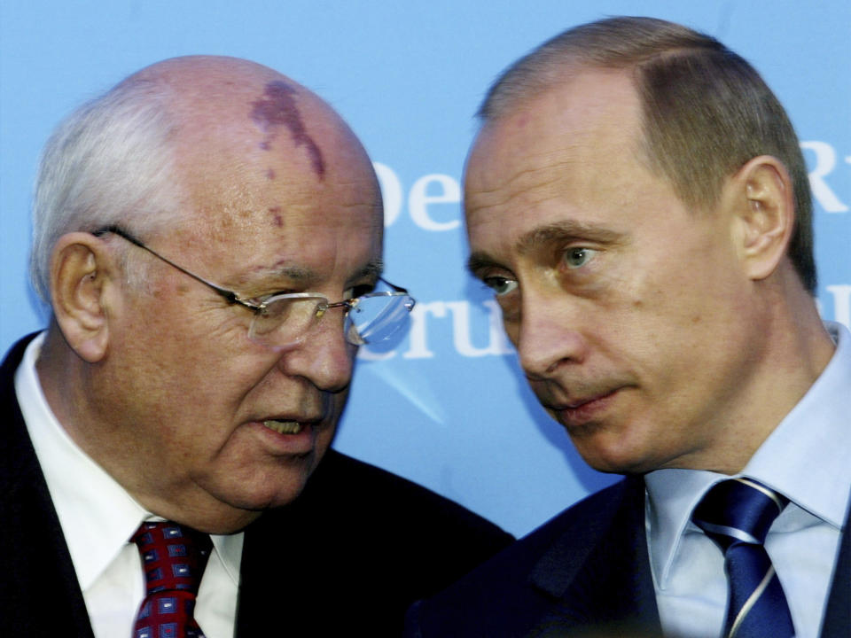 FILE - Russia's President Vladimir Putin, right, talks with former Soviet President Mikhail Gorbachev at the start of a news conference at the Castle of Gottorf in Schleswig, northern Germany, Tuesday, Dec. 21, 2004. Russian news agencies are reporting that former Soviet President Mikhail Gorbachev has died at 91. The Tass, RIA Novosti and Interfax news agencies cited the Central Clinical Hospital. (AP Photo/Heribert Proepper, File)