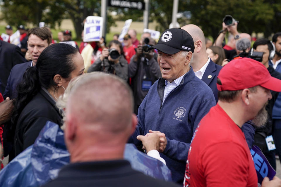 FILE - President Joe Biden greets striking United Auto Workers on the picket line, Sept. 26, 2023, in Van Buren Township, Mich. Despite a successful off-year election for Democrats, there remains a persistent fear within the party that there is a serious disconnect between the popularity of President Joe Biden's agenda and the man himself. (AP Photo/Evan Vucci, File)