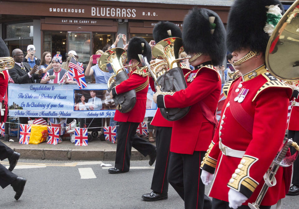 Visitors take pictures as the Changing of the Guard takes place outside Windsor Castle in Windsor ahead of the royal christening of the Duke and Duchess of Sussex's son, Archie, in the castle's intimate private chapel. RESS ASSOCIATION Photo. Picture date: Saturday July 6, 2019. See PA story ROYAL Christening. Photo credit should read: Rick Findler/PA Wire