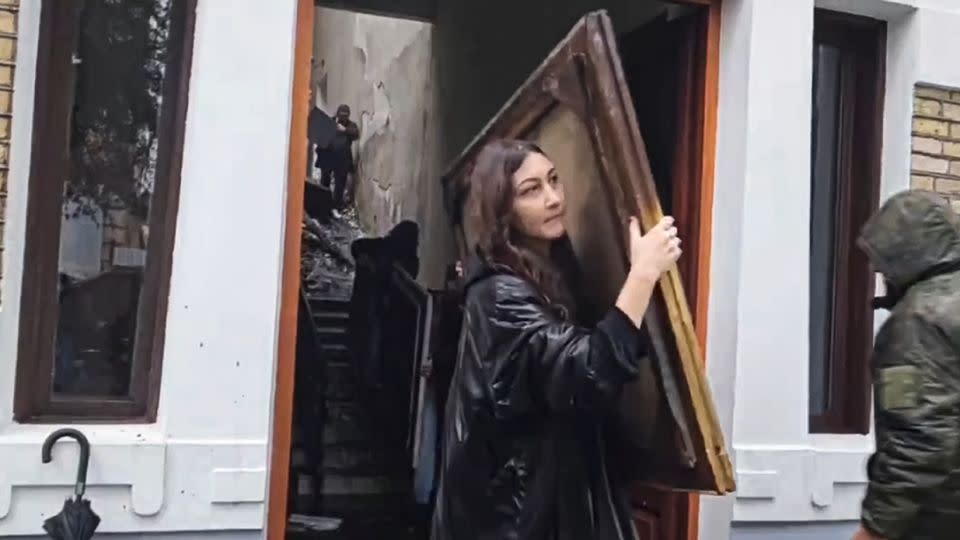 A video still shows gallery employees removing damaged paintings after the fire. - Robert Dzhpua/AP