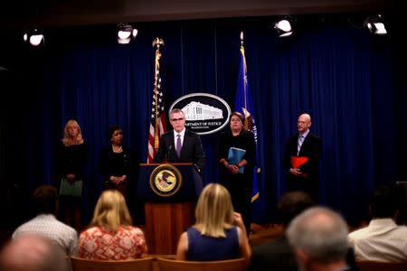 (L to R) U.S. Attorney Eileen M. Decker of the Central District of California, U.S. Attorney General Loretta E. Lynch, FBI Deputy Director Andrew McCabe, Assistant Attorney General Leslie R. Caldwell, and IRS Criminal Investigation Chief Richard Weber announce the filing of civil forfeiture complaints seeking the forfeiture and recovery of more than $1 billion in assets associated with an international conspiracy to launder funds misappropriated from a Malaysian sovereign wealth fund 1MDB in Washington July 20, 2016. REUTERS/James Lawler Duggan