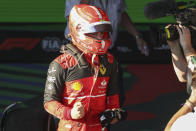 Ferrari driver Charles Leclerc of Monaco reacts after winning the Australian Formula One Grand Prix in Melbourne, Australia, Sunday, April 10, 2022. (AP Photo/Asanka Brendon Ratnayake)