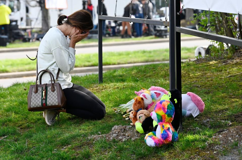 Carolyn Lucas cries at the makeshift memorial by the entrance of the Covenant School Tuesday in Nashville. Three children and three school staff members were killed by a former student in Monday’s mass shooting.