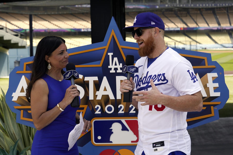 Los Angeles Dodgers' Justin Turner, right, speaks with Alanna Rizzo of the MLB Network during an event to officially launch the countdown to MLB All-Star Week Tuesday, May 3, 2022, at Dodger Stadium in Los Angeles. The All-Star Game is scheduled to be played on July 19. (AP Photo/Mark J. Terrill)