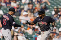 Cleveland Guardians third baseman Jose Ramirez fist bumps third base coach Mike Sarbaugh after a two-run home run during the ninth inning of a baseball game against the Detroit Tigers, Saturday, May 28, 2022, in Detroit. (AP Photo/Carlos Osorio)