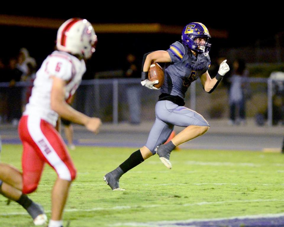 Escalon receiver Sam Jimenez (5) turns up field after catching the ball during a game between Escalon High School and Ripon High School in Escalon, California on October 20, 2023. 