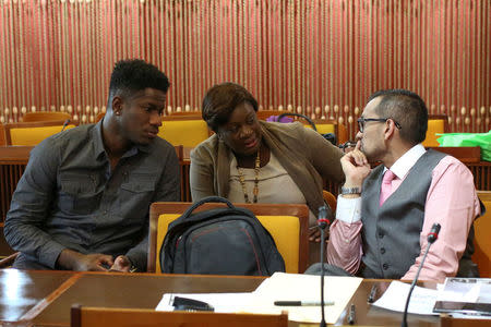 Former Jamaican world championship relay medallist Riker Hylton (L), his sister Tanisher (C) and his attorney Emir Crowne sit during a panel after filing an application to have Hylton's provisional ban for breaching anti-doping rules dismissed, in Kingston, Jamaica March 30, 2017. REUTERS/Gilbert Bellamy