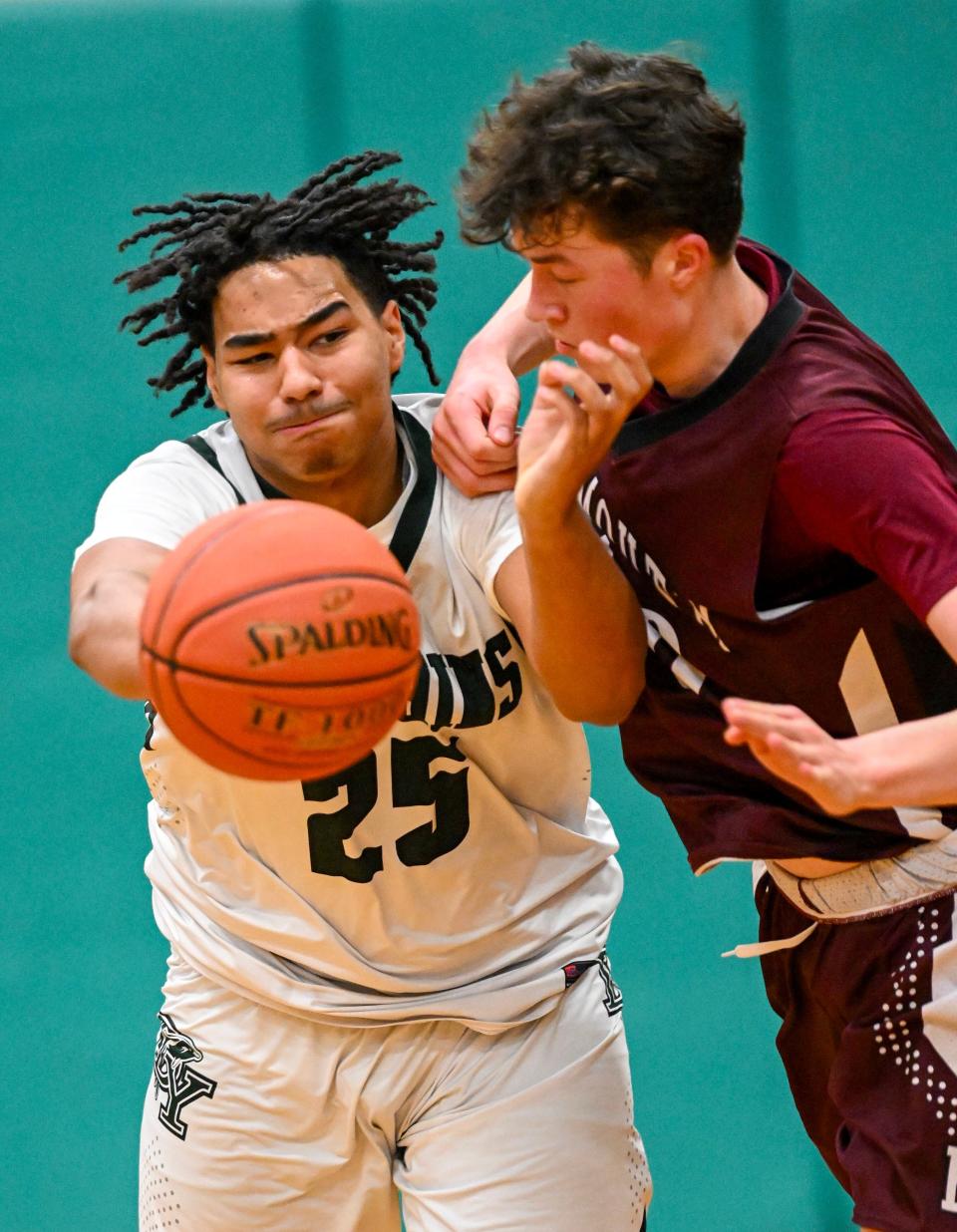 Sam Stoermer of Falmouth and Elijah Grant of D-Y tangle.